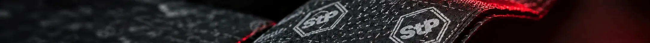 Close-up of StP damping sheet, its foil embossed with the StP mark