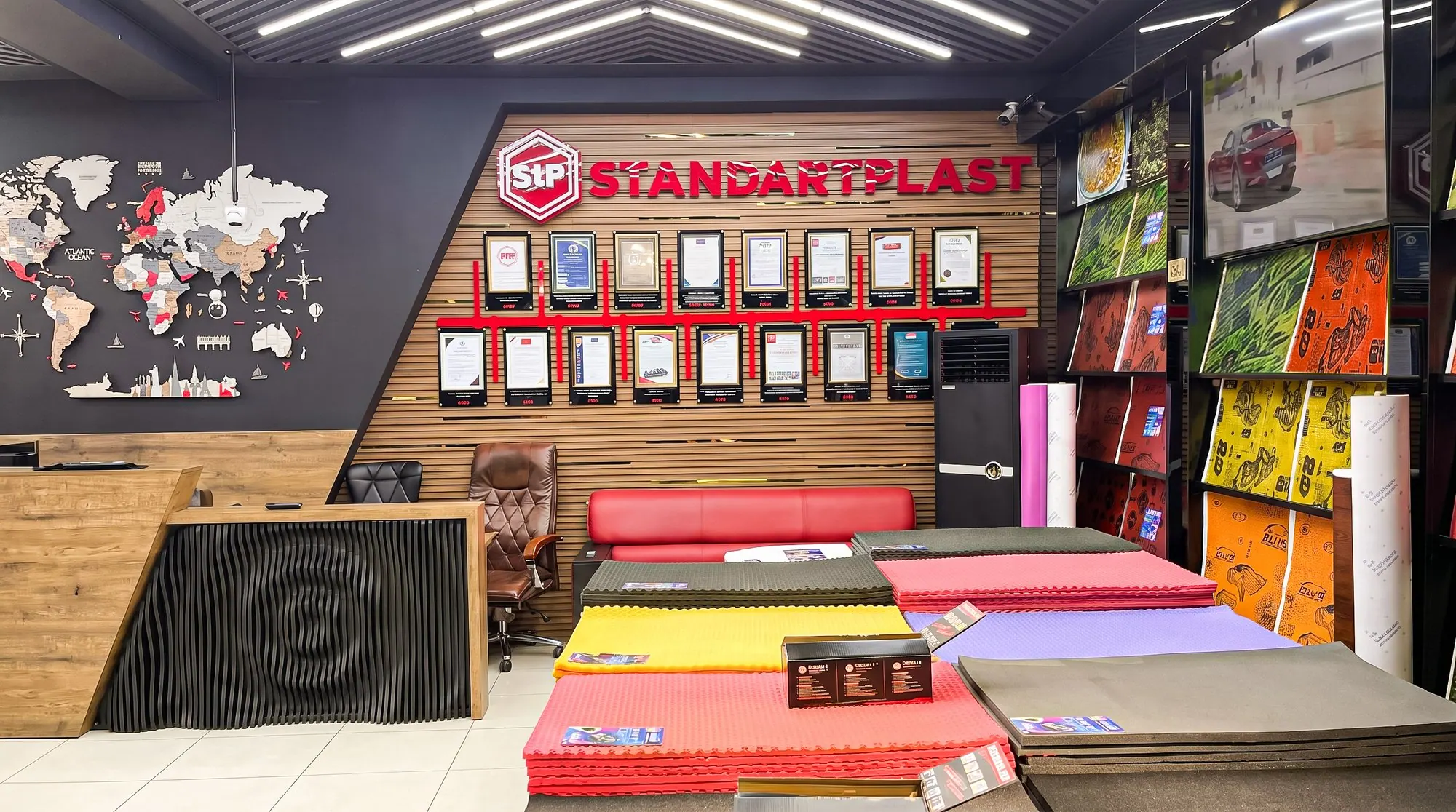 Standartplast brand wall with material samples and the display table